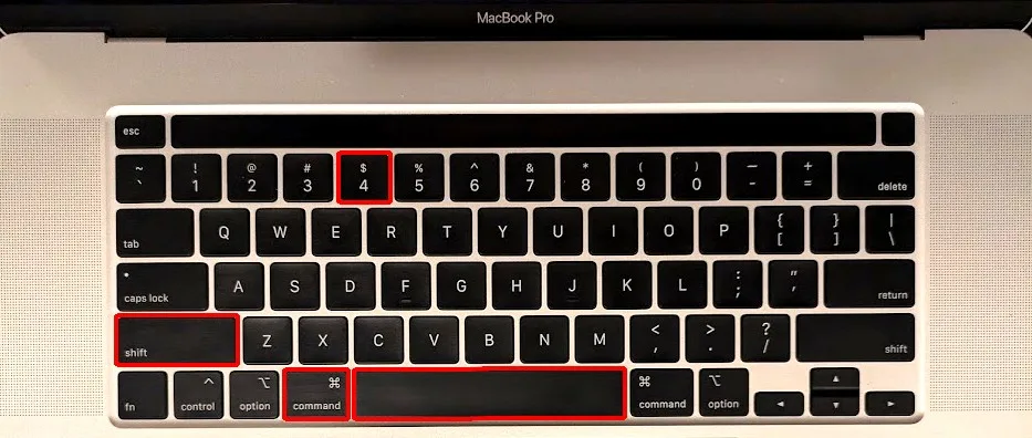 Image of MacBook Pro keyboard with 4 keys outlined in red