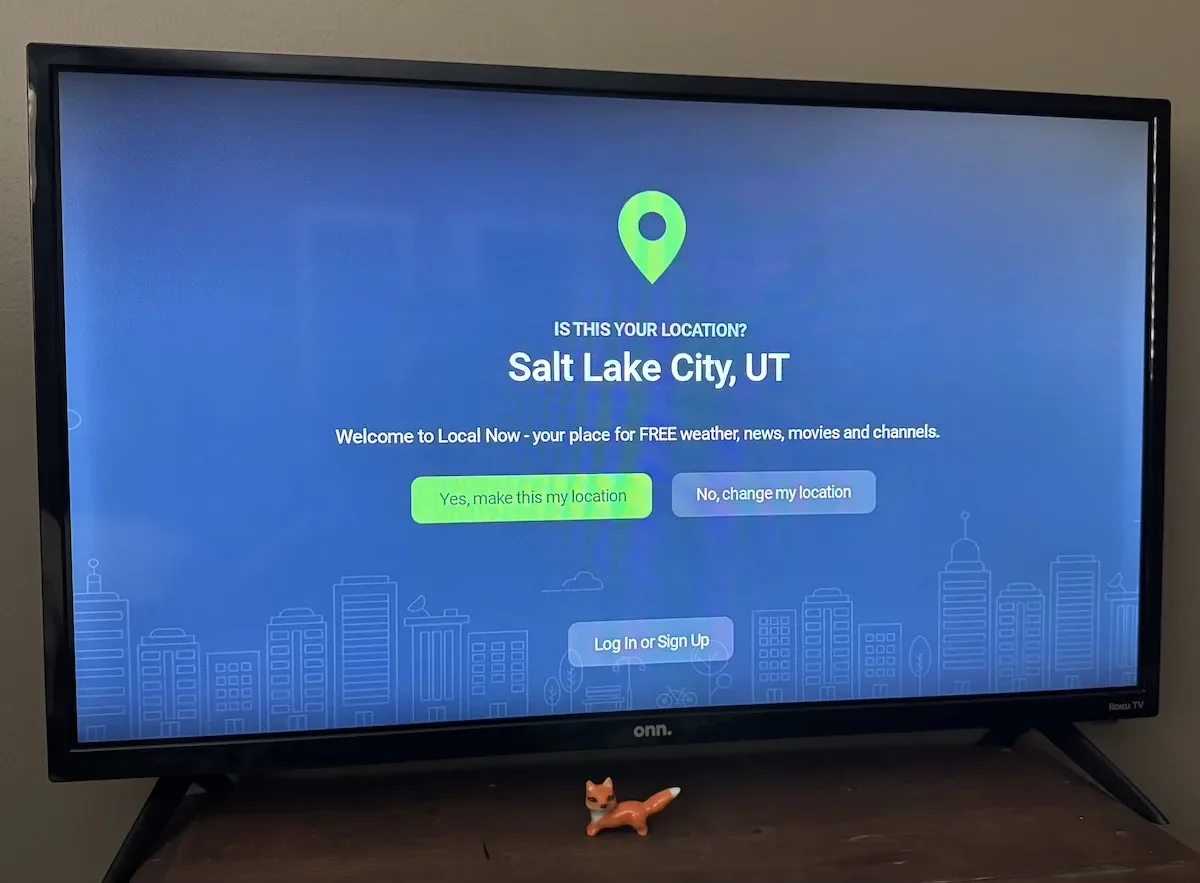 Photo of the location verification screen within the Local Now app on a TV.